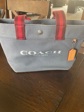 Coach Blue Canvas Tote with Red Striped Handles and Orange Tag